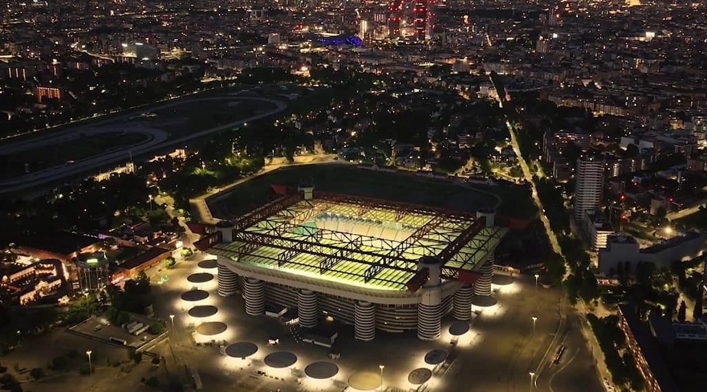 Milan Hotel for Sale — Property of an Upscale Hotel 3 Milan: the San Siro stadium lit up at night, seen from above