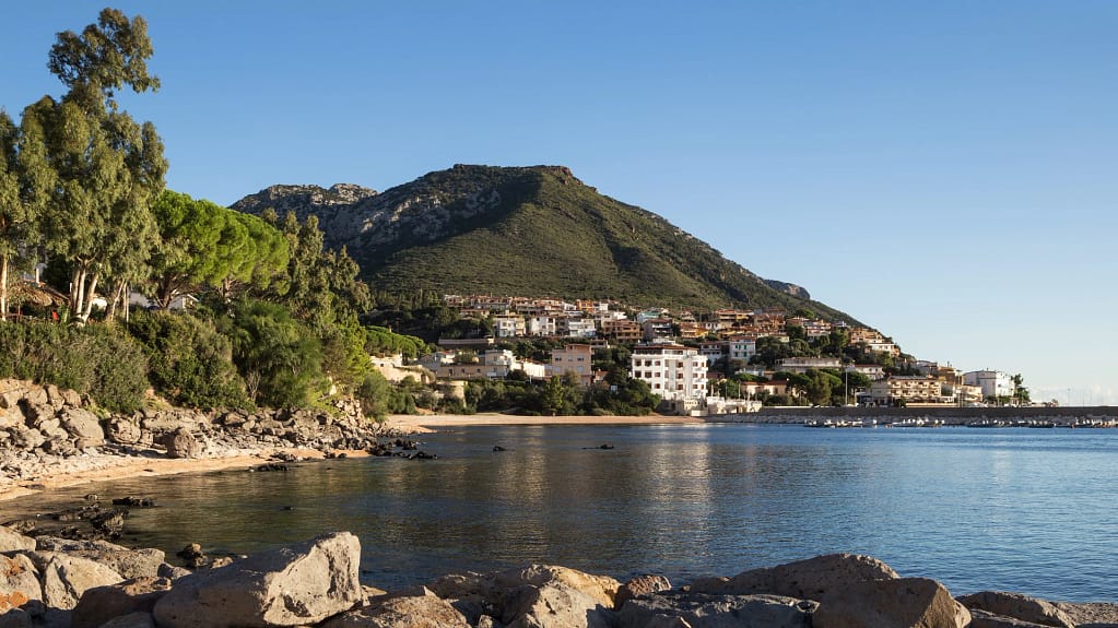 Sardinia Resort for Sale — Over 900 Rooms 3 Sardinia: the bay of Cala Gonone with the village and the mountain behind