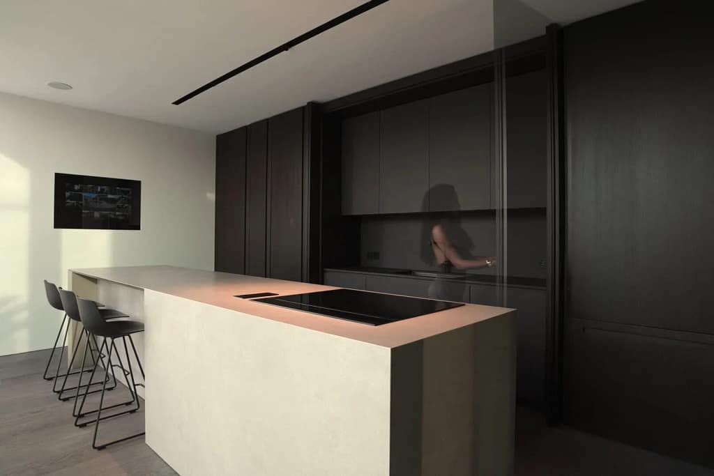 About 8 About Elite Luxury Real Estate: kitchen with a light island and wood panelling, a studio project