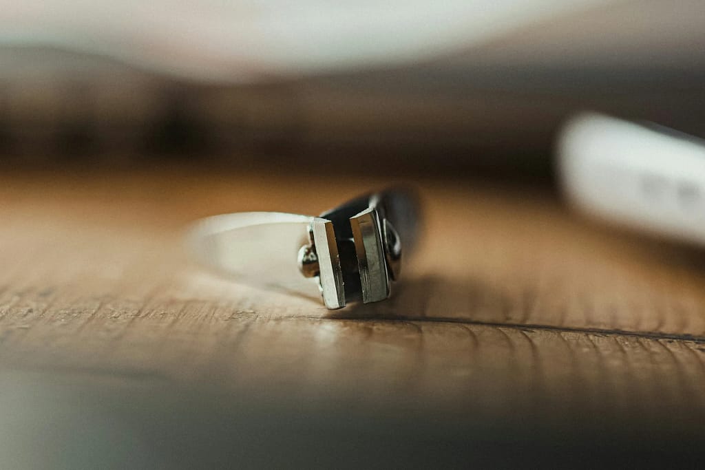 Biohacking: smart ring on a wooden table