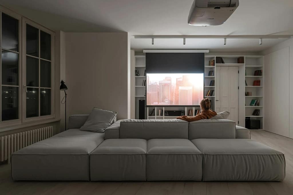 Home Automation — Security and Robotics 4 Home automation: living room with sofa and integrated screen (illustrative photo)