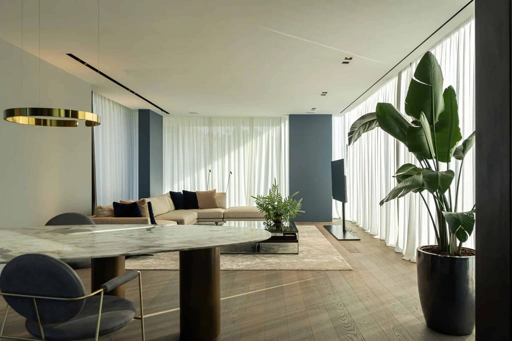 Designer Lighting — The Lighting Design of the Villa 9 Living room with full-height curtains and glazing onto the garden, a project by Federico Cappellina's studio