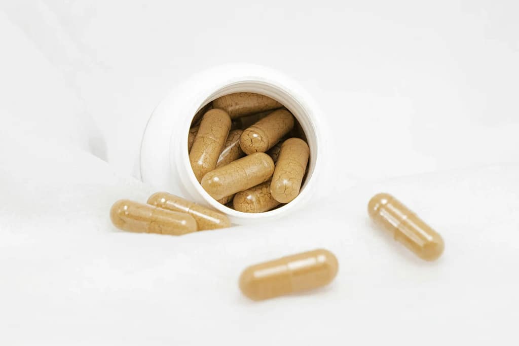Longevity Supplements 2 Longevity supplements: capsules and a white supplement bottle