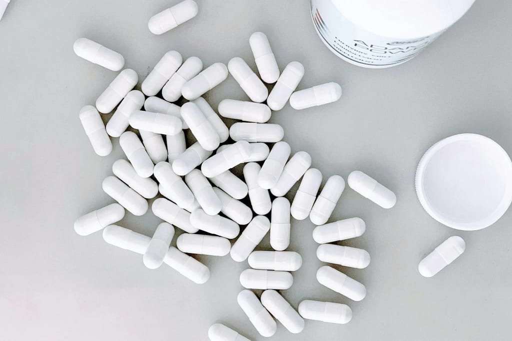 Longevity Supplements 8 Longevity supplements: white tablets on a light background