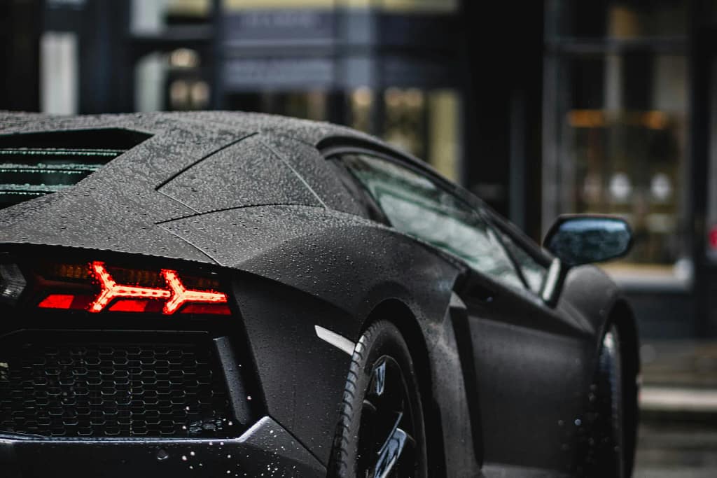 Private Luxury Mobility — Jets & Beyond for UHNW Clients 4 Rear of a luxury supercar: prestige car rental within private luxury mobility