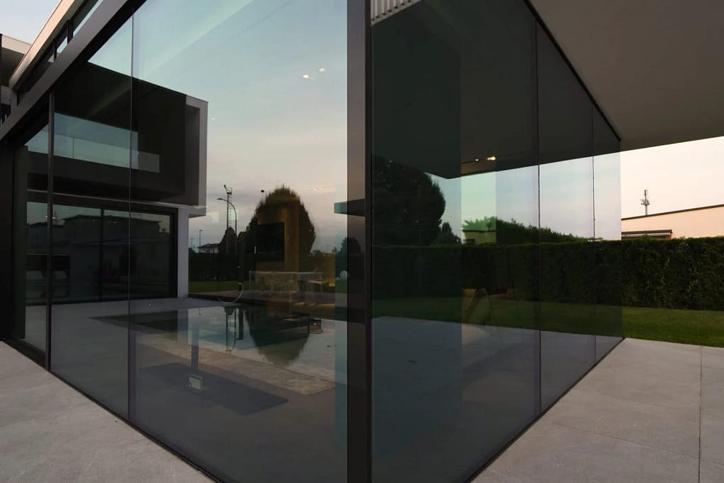 Luxury Windows — Glazing and Doors 1 Luxury windows: glazed corner overlooking the pool