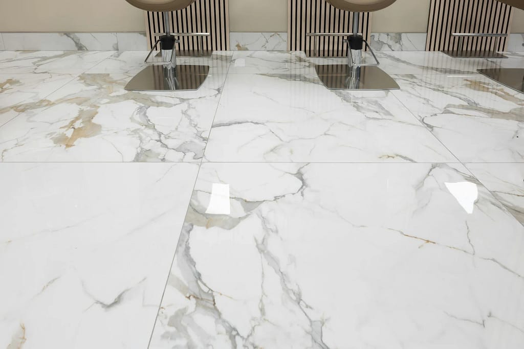 Porcelain Tiles — Large Slabs Inside and Out 12 Porcelain tiles in large marble-effect slabs (illustrative photo)