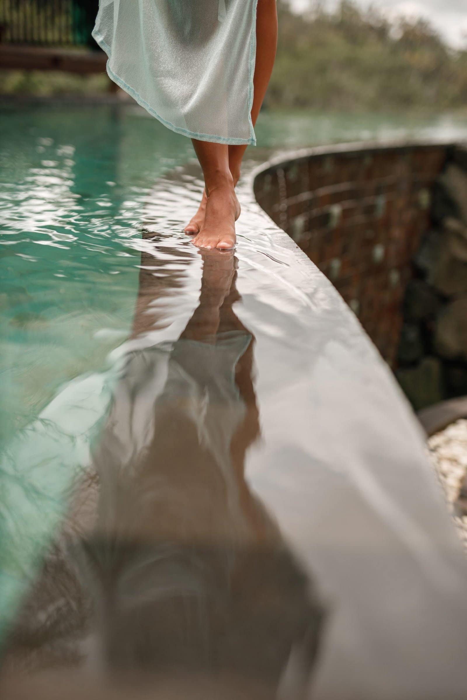 Happy,Young,Woman,In,Long,Dress,Walking,On,The,Edge