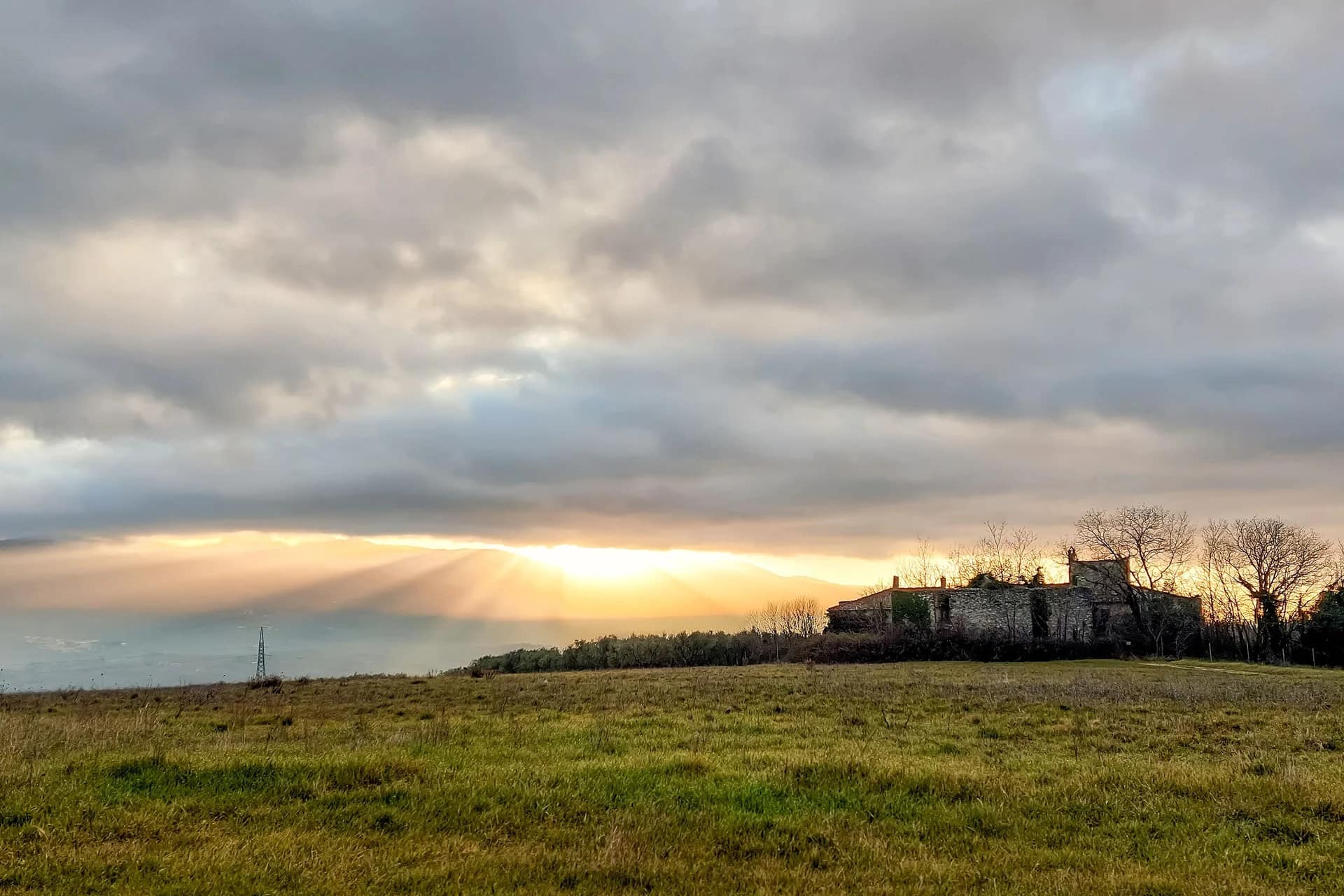 Made in Italy 71 Sunrise over an old farmhouse complex in the countryside of Rignano sull'Arno, Tuscany